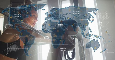 Female boxer training with heavy bag and futuristic global data overlay in sunlit gym