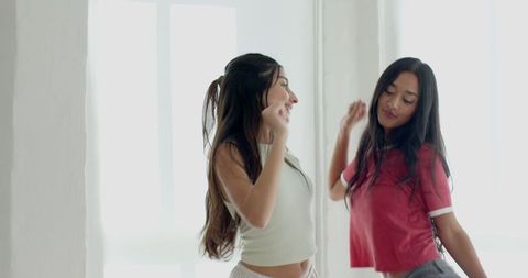 Joyful Diverse Friends Dancing in Bright Minimalist Studio