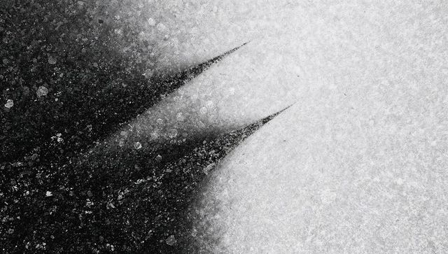 Monochrome frost with sharp shadow spikes, granular ice texture, abstract minimal design