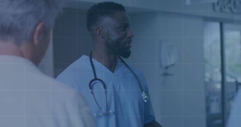 Healthcare professionals discussion in hospital corridor