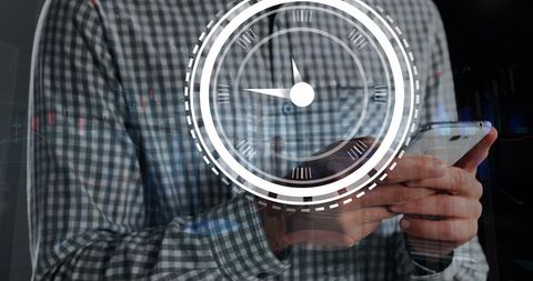 Businessman analyzing data with clock overlay concept