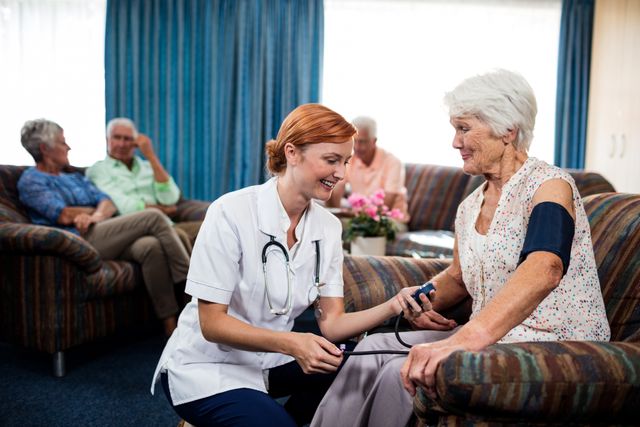 Nurse taking care of pensioner in the retirement house