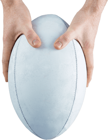 Close-up view of hands holding transparent rugby ball