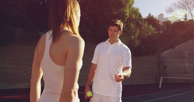 Tennis Coach Instructing Female Player on Outdoor Court - Download Free Stock Images Pikwizard.com