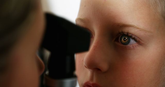 Doctor Examining Child's Eye with Ophthalmoscope - Download Free Stock Images Pikwizard.com