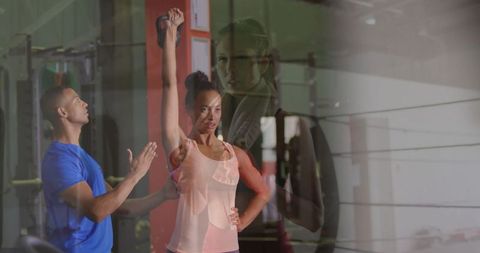 Personal trainer clapping for client's kettlebell accomplishment