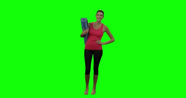 An athletic woman holding a yoga mat and smiling, standing against a bright green screen background. Perfect for use in fitness products advertisements, health and wellness promotions, workout programs, or digital content creation.