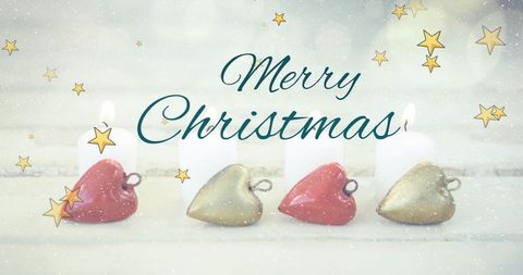 Merry Christmas Text with Candy Hearts and Burning Candles