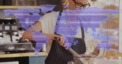 Barista Stirring Ingredients at Cafe Counter
