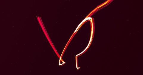 Dynamic flow of red glowing lines on black background