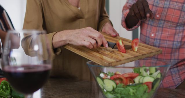 Hands Preparing a Healthy Vegetable Salad in a Kitchen Setting - Download Free Stock Images Pikwizard.com