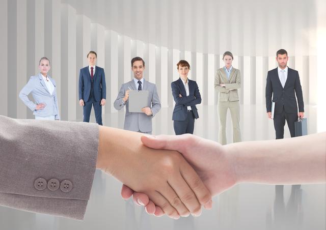 Digital generated image of business executives shaking hands while colleagues standing in background