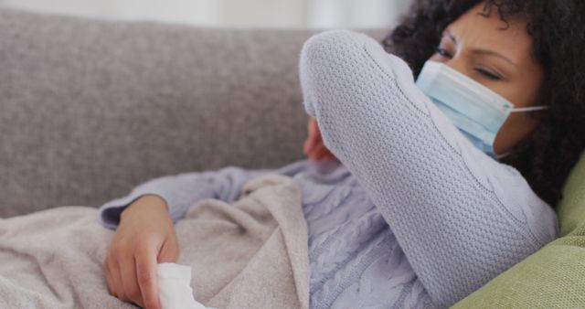 Sick Woman Wearing Mask Coughing at Home on Sofa - Download Free Stock Images Pikwizard.com