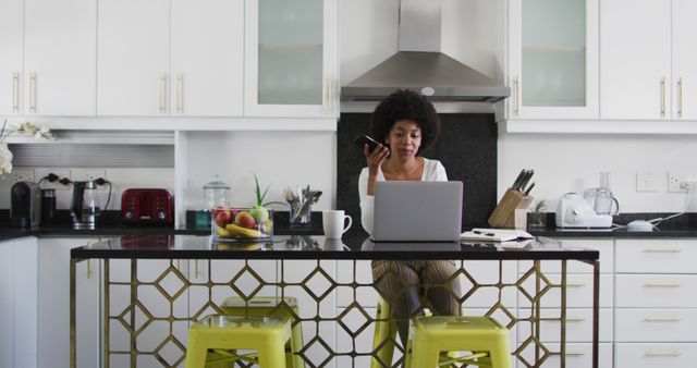 Young Woman Working from Home in Modern Kitchen, Using Laptop and Smartphone - Download Free Stock Images Pikwizard.com