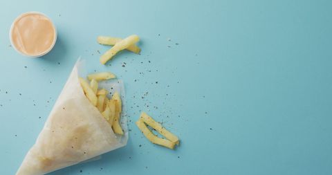 Crispy Wrapped Fries with Dip on Vibrant Blue Background - Download Free Stock Images Pikwizard.com