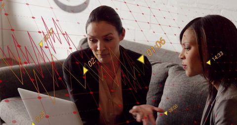 Collaborating on performance analytics using laptop with interactive charts overlay