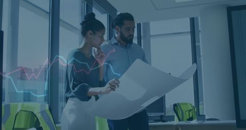 Professionals analyzing financial growth charts in modern office