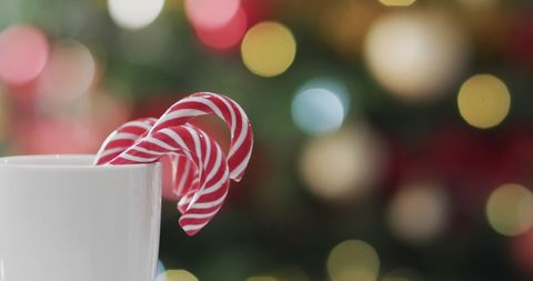 Festive Candy Canes in Mug with Christmas Bokeh Background - Download Free Stock Images Pikwizard.com