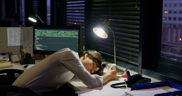 Overworked Software Developer Sleeping On Desk At Office - Download Free Stock Images Pikwizard.com