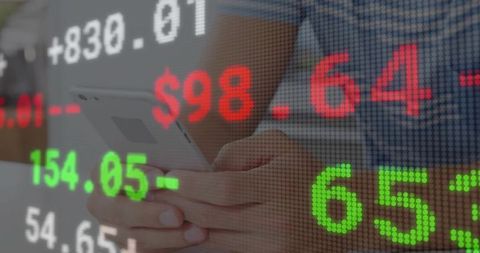 Analyzing stock market trends with smartphone in modern office