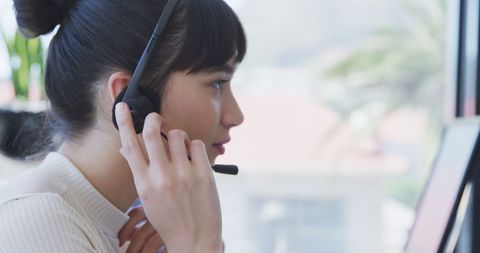 Professional Woman Using Headset in Modern Office Environment - Download Free Stock Images Pikwizard.com