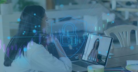 Digital security illustration over woman video calling with laptop