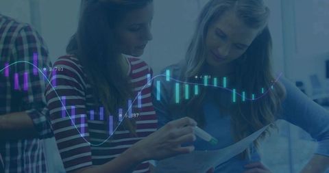 Colleagues Analyzing Report with Financial Data Overlay