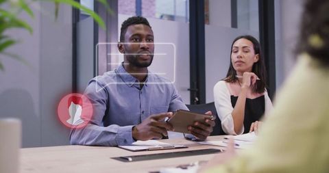 Corporate Team Meeting with Diverse Professionals and Digital Interaction