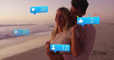 Happy Couple Embracing on Beach with Social Media Pop-ups