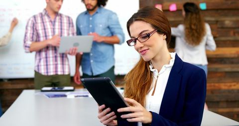 Business Executive Using Tablet During Office Meeting - Download Free Stock Images Pikwizard.com