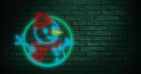 Snowman Neon Light Against Green Brick Wall Holiday Vibes