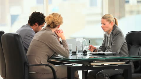 Team Engaging in Thoughtful Business Meeting