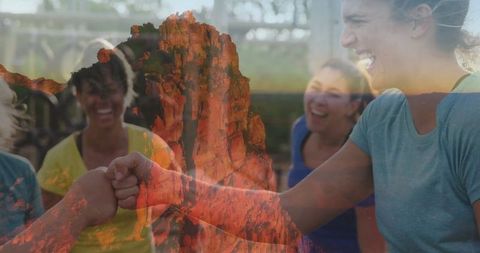 Energetic Team Fist Bump Wearing Sportswear with Cliff Overlay