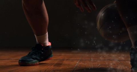 Dynamic Action of Basketball Dribbling on Wooden Floor