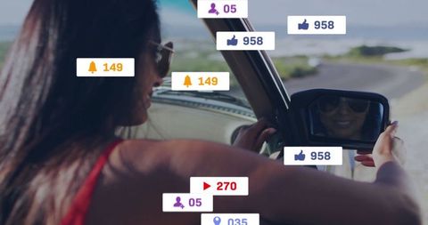 Woman adjusting mirror in car with social media icons overlay