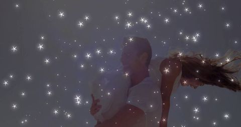 Romantic Couple Sharing Joyful Moments Under Sparkling Sky