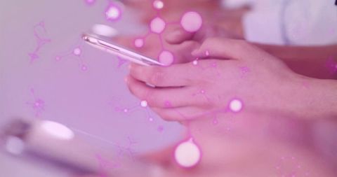 Business Hands Collaborating on Smartphones with Digital Overlay