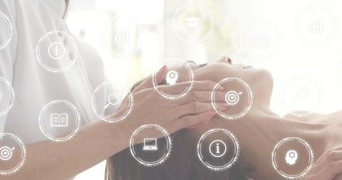Therapist placing hands on client during relaxing head massage with wellness icons overlay