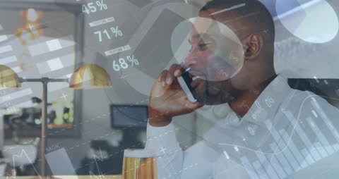 African American Businessman Discussing Financial Data on Smartphone