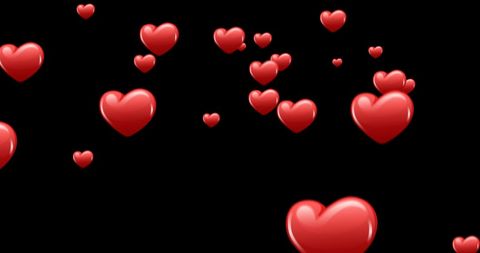 Glowing Red Hearts Floating on Black Background