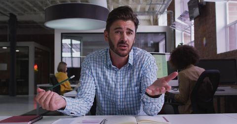 Confident Businessman Conducting Video Conference in Modern Office - Download Free Stock Images Pikwizard.com