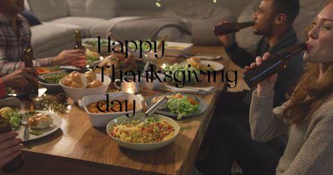 Happy Friends Celebrating Thanksgiving with Dinner and Drinks