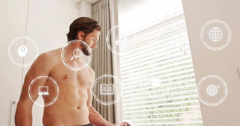 Shirtless man adjusting blinds in sunlit bedroom with digital interface overlay