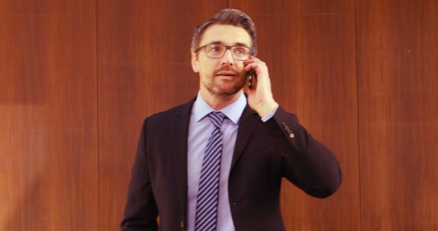 Businessman in Suit Taking Important Call in Office - Download Free Stock Images Pikwizard.com