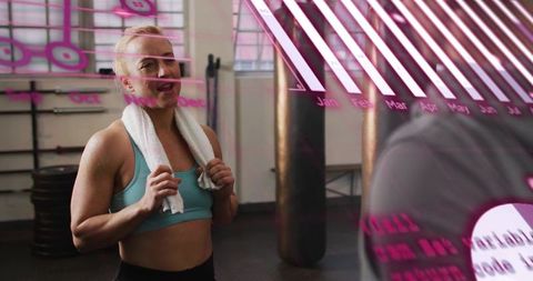 Workout partners pausing after training in gym, woman holding towel under pink overlay