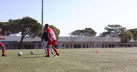 Soccer player practicing dribbling skills on outdoor field