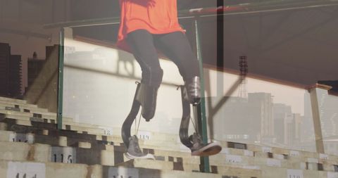 this visual shows an athlete, with prosthetic legs, exercising on stairs intertwined with a cityscape backdrop, symbolizing resilience and determination. ideal for campaigns promoting inclusive sports, rehabilitation inspiration, or conveying the message of empowerment and overcoming challenges in adversity.