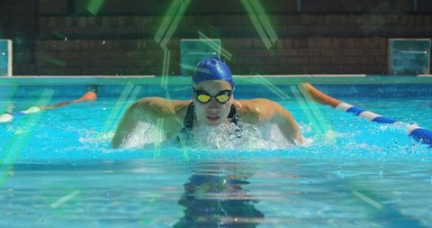 Competitive Swimmer Performing Butterfly Stroke in Pool with Lane Markers