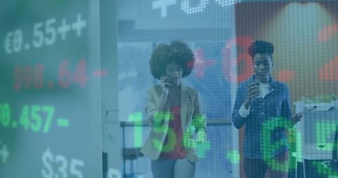 Business women in office with digital stock market display overlay