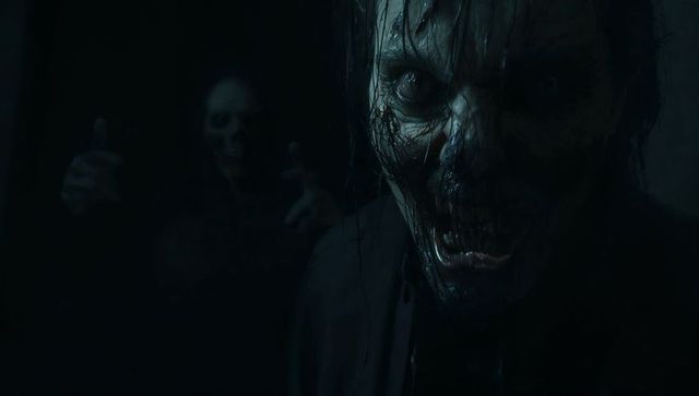 Creepy Zombie Figures in Dark Corridor with Tattered Clothing